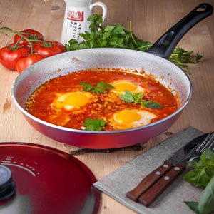 Cookware with decorative outer coating